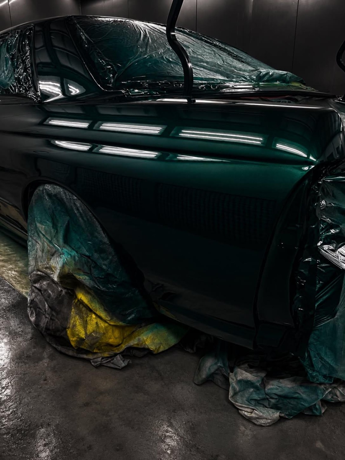 Green coupe — fresh paint in the booth